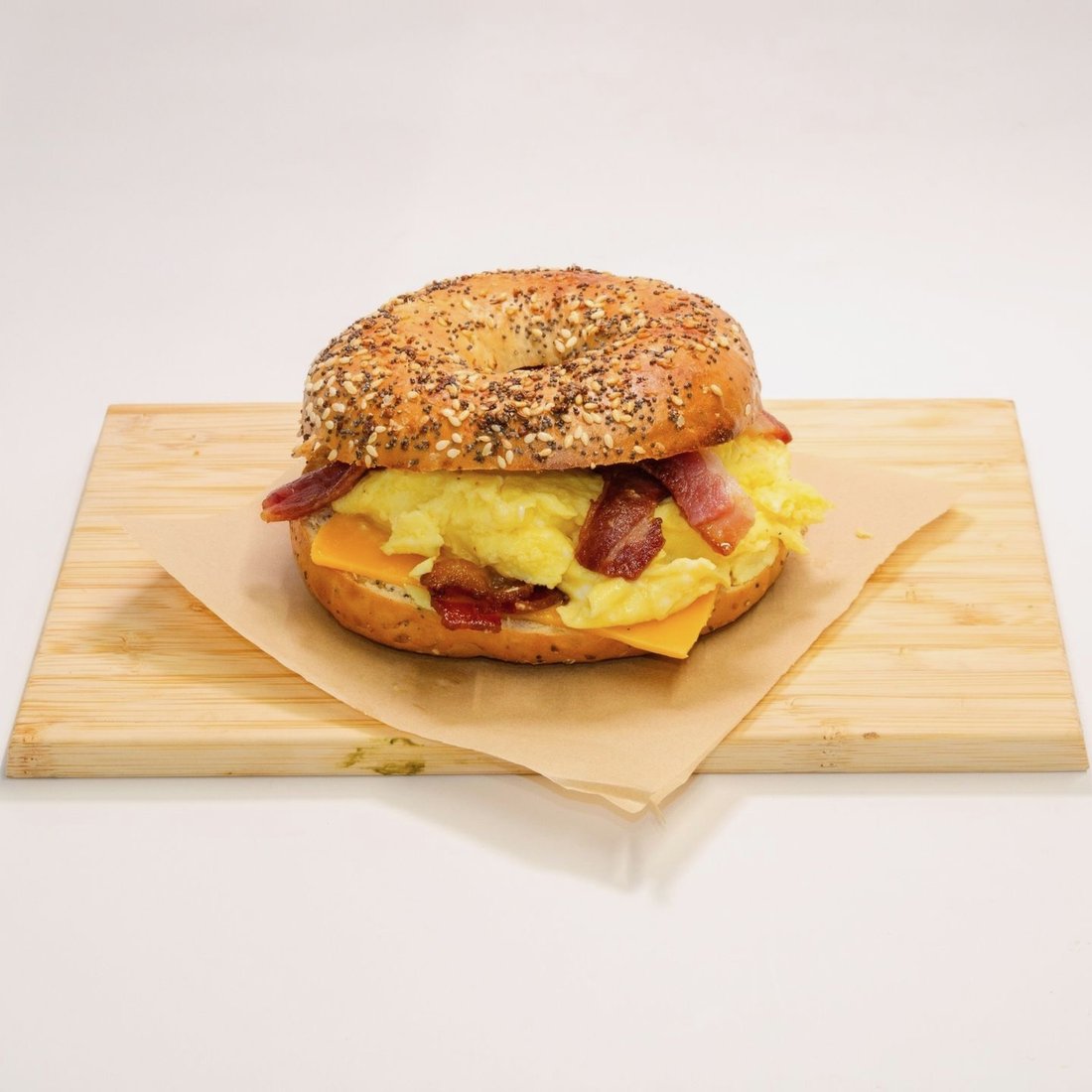 Everything bagel breakfast sandwich with egg, bacon and cheddar at Dèlf Café